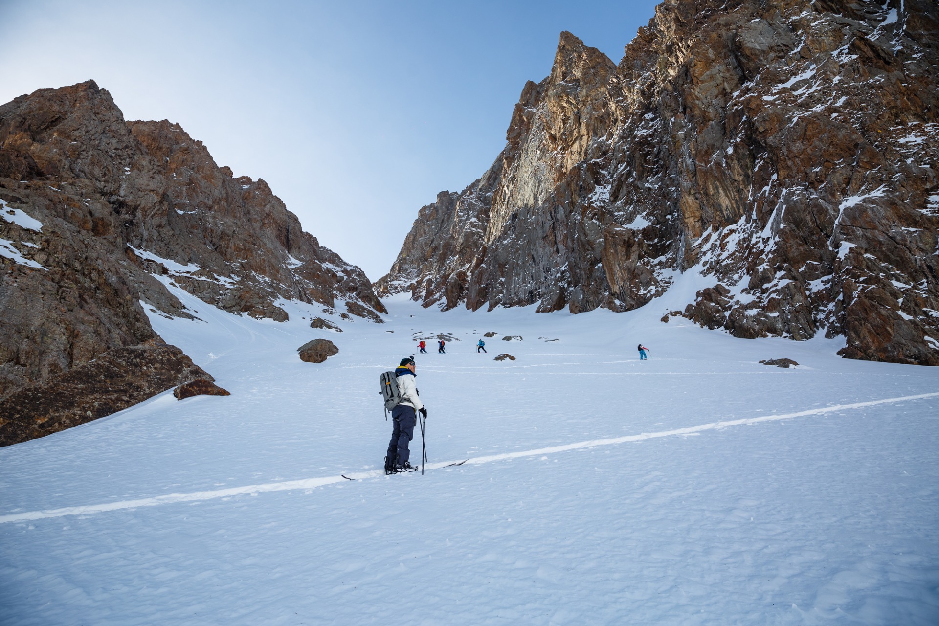 group ski touring up the couloir at Shymbulak ski resort