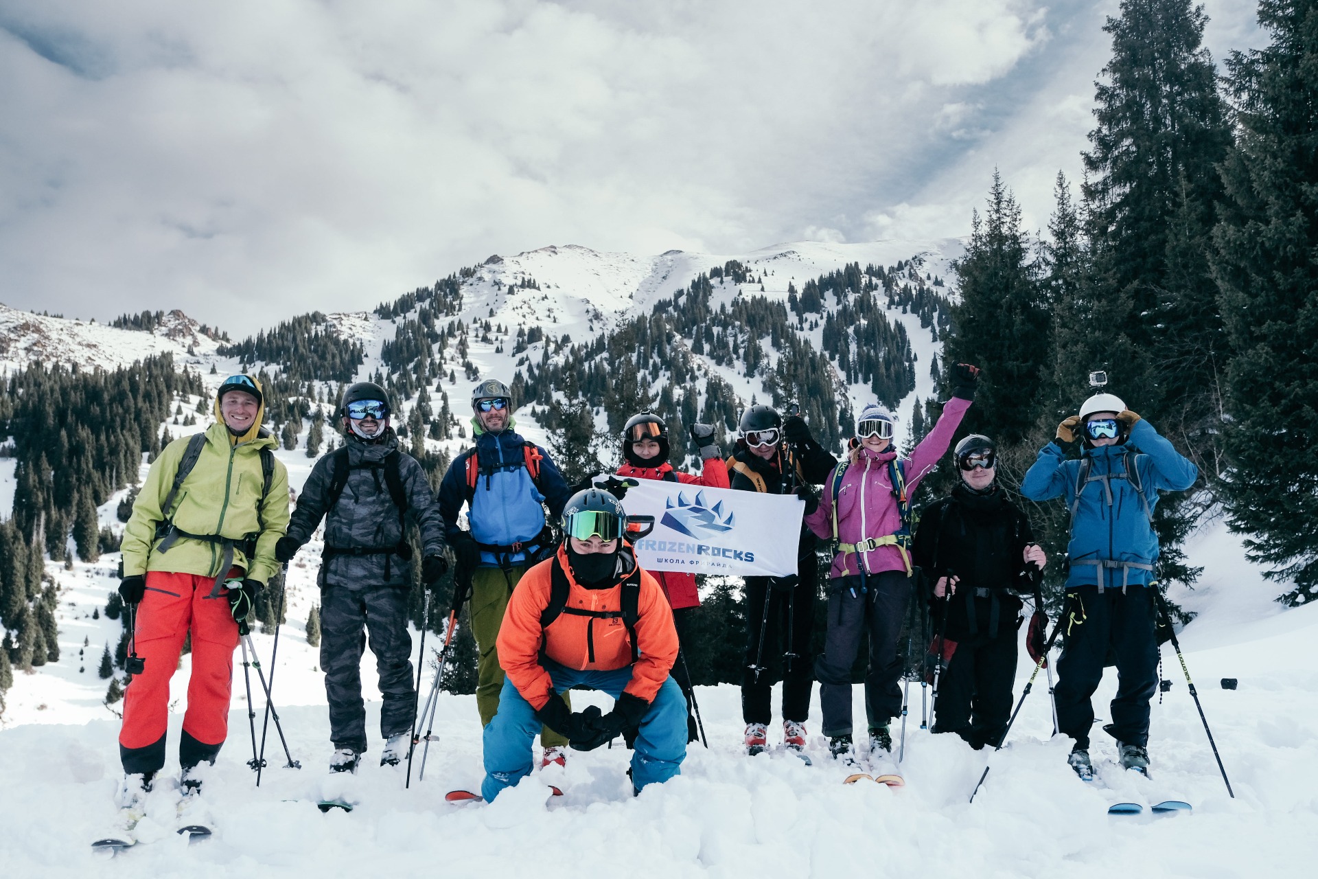 group of skiers and snowboarders on the top of the mountain in Kimasar gorge