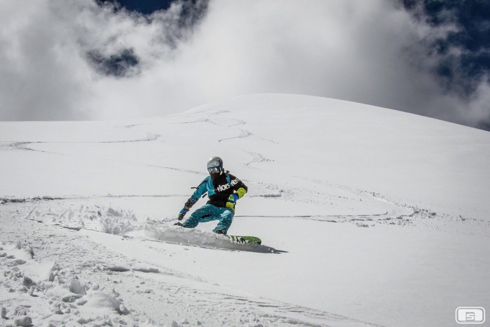 snowboarder on Karlytau peak Kazakhstan