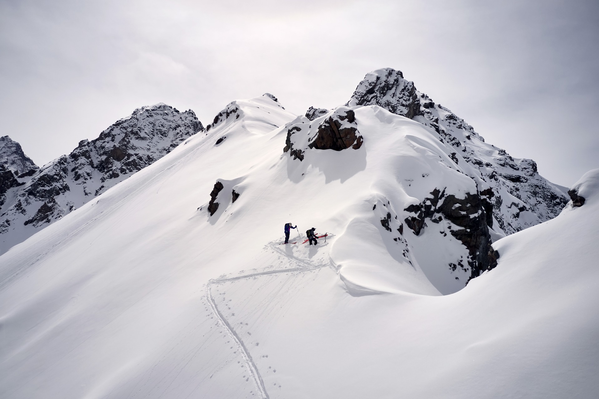 ski touring to Shkolnik peak above  Shymbulak from drone